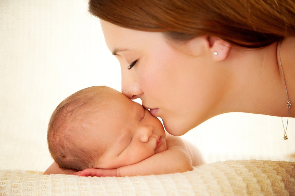 mom-kissing-newborn-son.jpg